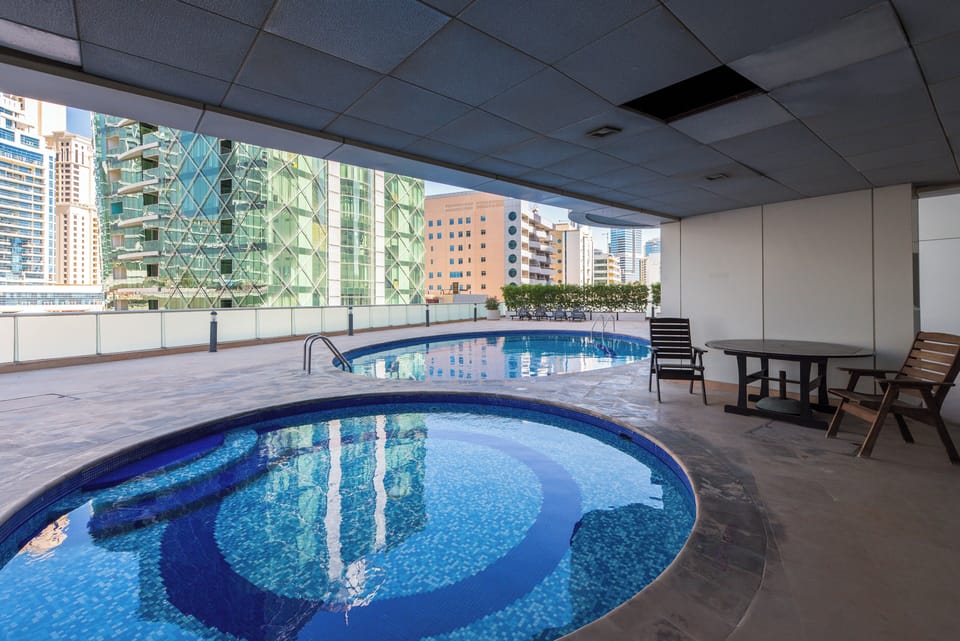 Outdoor pool, pool umbrellas, sun loungers