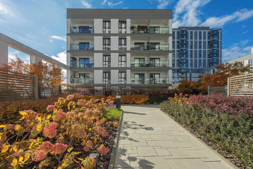 Colorful courtyard with beautiful greenery and walking paths.