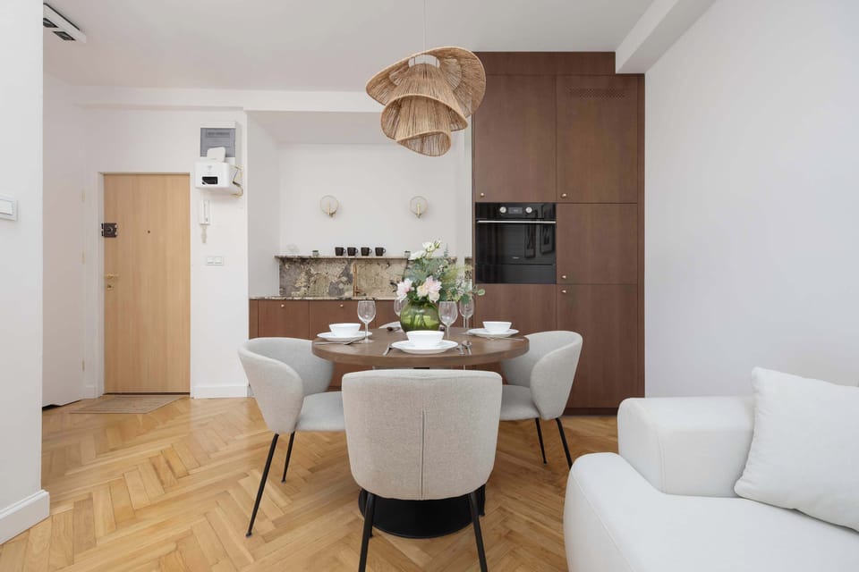 The open-plan kitchen and living room form a harmonious, functional space perfect for cooking together and chatting over a glass of wine.