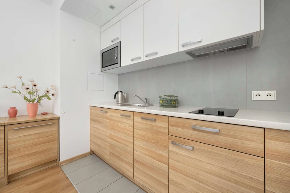 The fully equipped kitchenette includes everything you need for a home-cooked meal.
