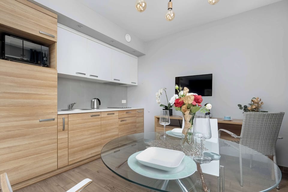 The sleek design of the kitchenette blending seamlessly with the living area.