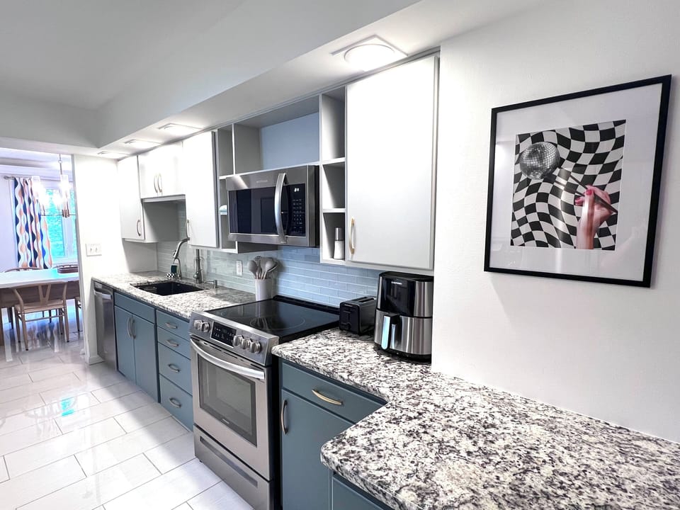 Kitchen with air fryer and all appliances needed to make a home cooked meal