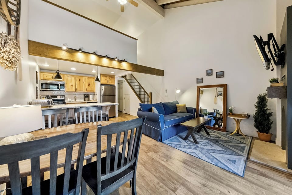 Relax in your spacious open-plan retreat, where rustic beams meet modern comfort and the full kitchen invites home-cooked meals.