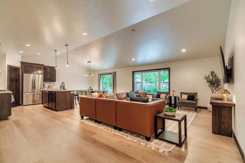 Step inside this stunning new build just 3 houses from Lambeau Field! The open-concept living room, dining area, and kitchen feature modern finishes, stylish décor, and plenty of space to relax or entertain before and after the big game.