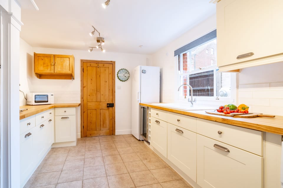 Ground floor: Kitchen with a Ranger cooker with five burner gas hob, wine fridge, full height fridge, microwave, dishwasher and coffee machine