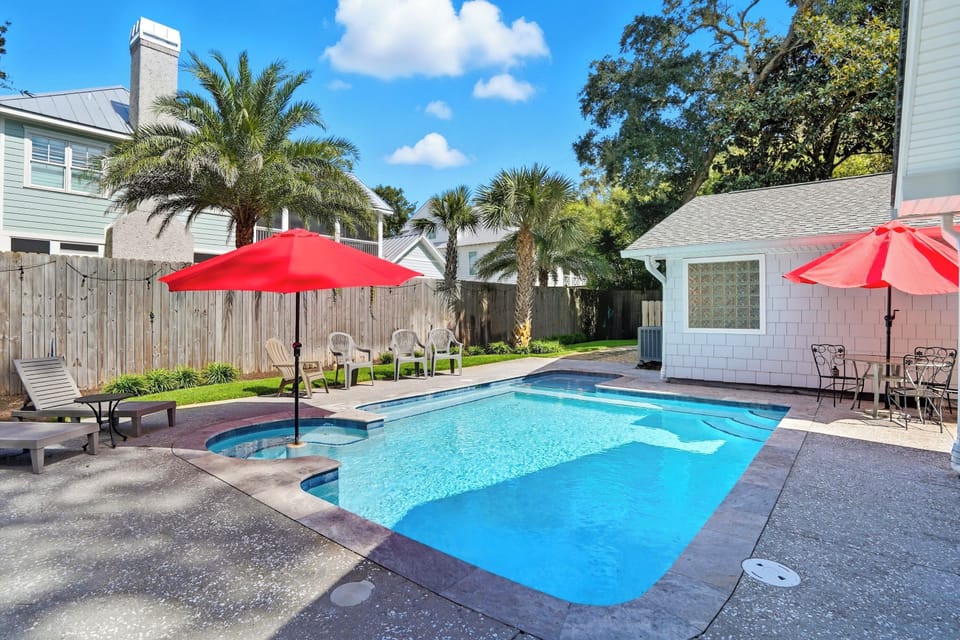 Private Pool & Palm-Lined Patio - Palm-framed backyard with a private pool, red umbrellas, and full sun from morning through afternoon—relax, swim, repeat.