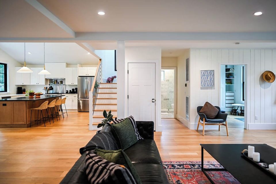 View of kitchen, stairs, living room, bathroom and flex room