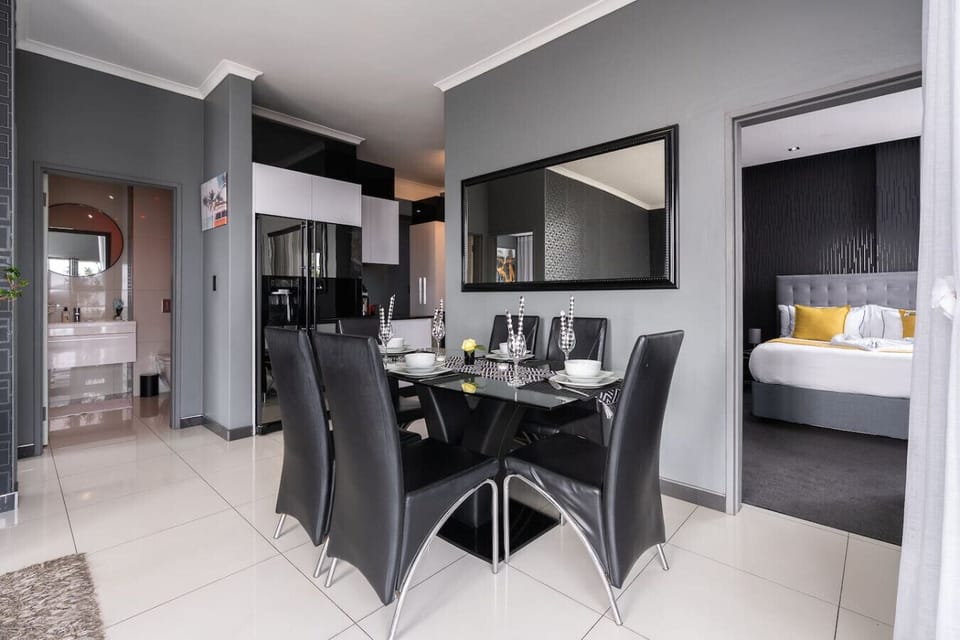 Dining Area: Dine in a sleek, modern space featuring refined elegance and a warm ambiance, creating the perfect setting for unforgettable meals and lasting memories.