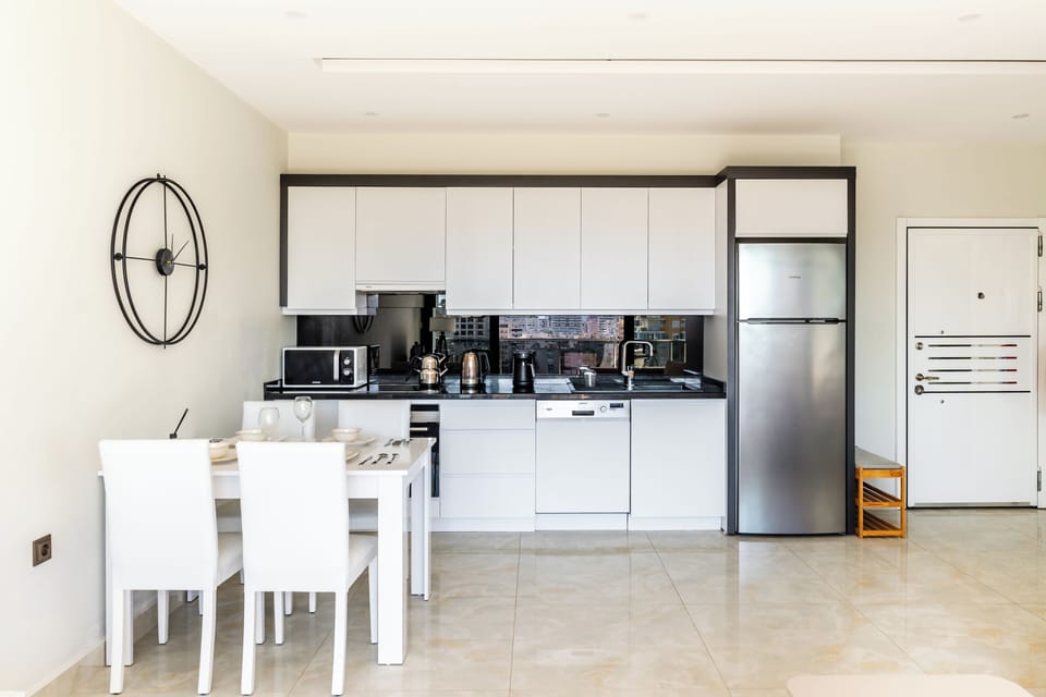 The living room, dining table and open style fully equiped kitchen