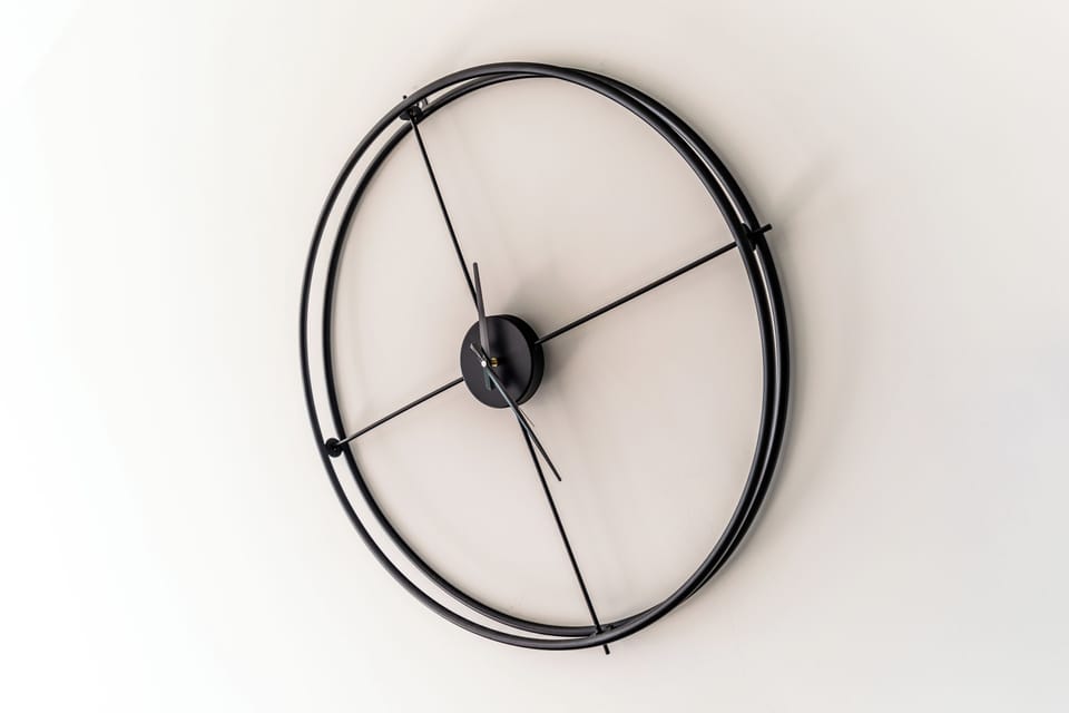 Large aesthetic wall-clock over the dining table