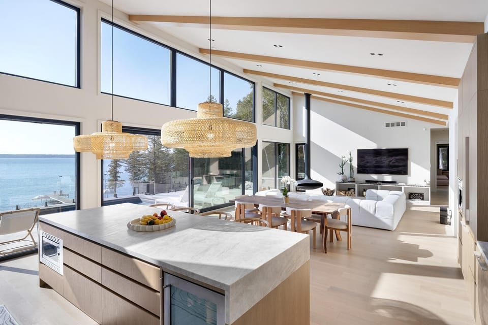Sunlit kitchen and living area with panoramic ocean views