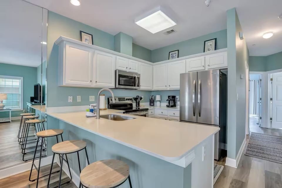 Apartment, Partial Ocean View | Private kitchen | Coffee/tea maker, dining table