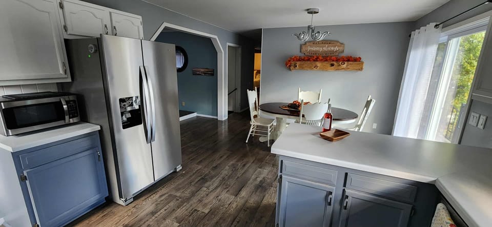 Dining area with patio to balcony with porch swing