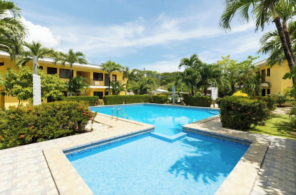 Crystal clear refreshing pool awaits, just steps from your door