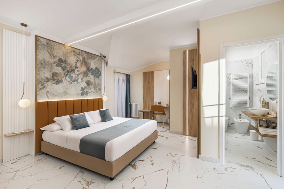 Deluxe Suite, Balcony, City View | In-room safe, desk, laptop workspace, blackout drapes