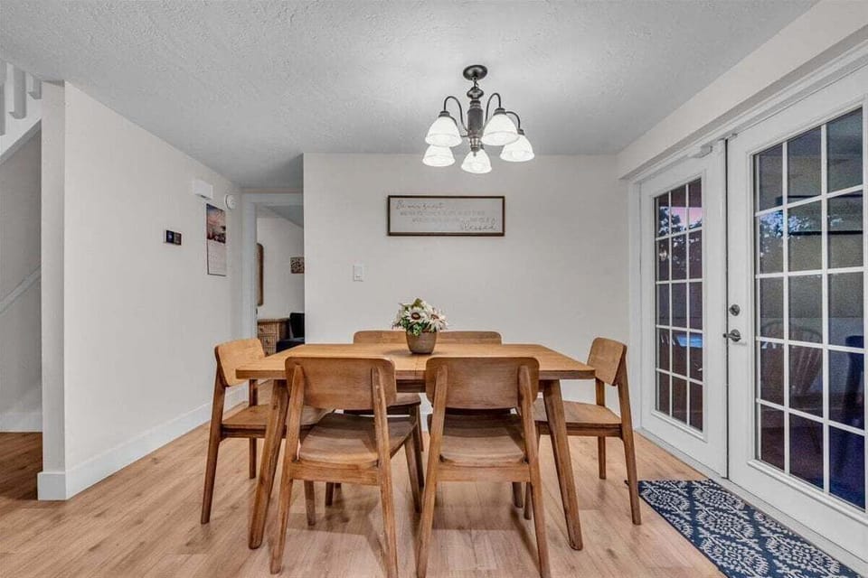 The dining room table seats 6 people and has french doors leading to the backyard area.