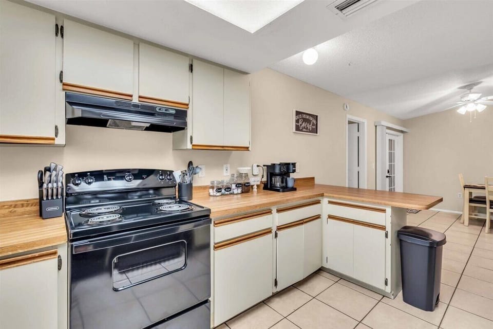 Full kitchen with a stove and coffee station for morning breakfast memories