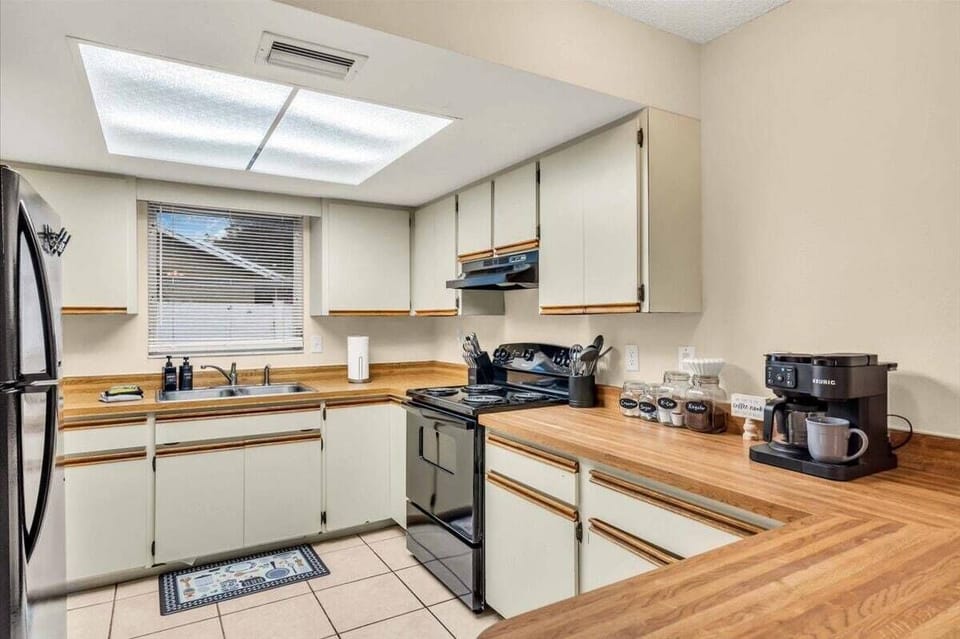 Full kitchen with plenty of light and a window by the sink to look outside