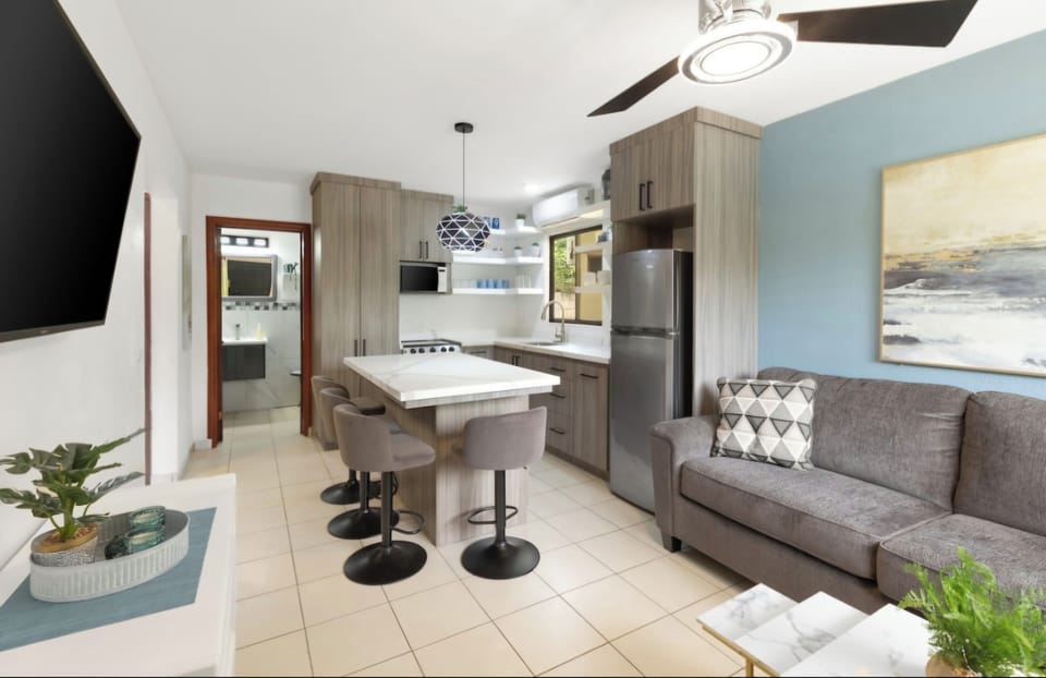 Incredible open living with a full size, comfortable sofa and island seating