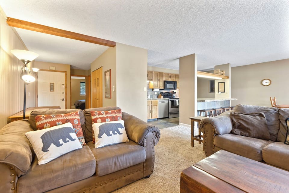 Living room with smart TV and gas fireplace.