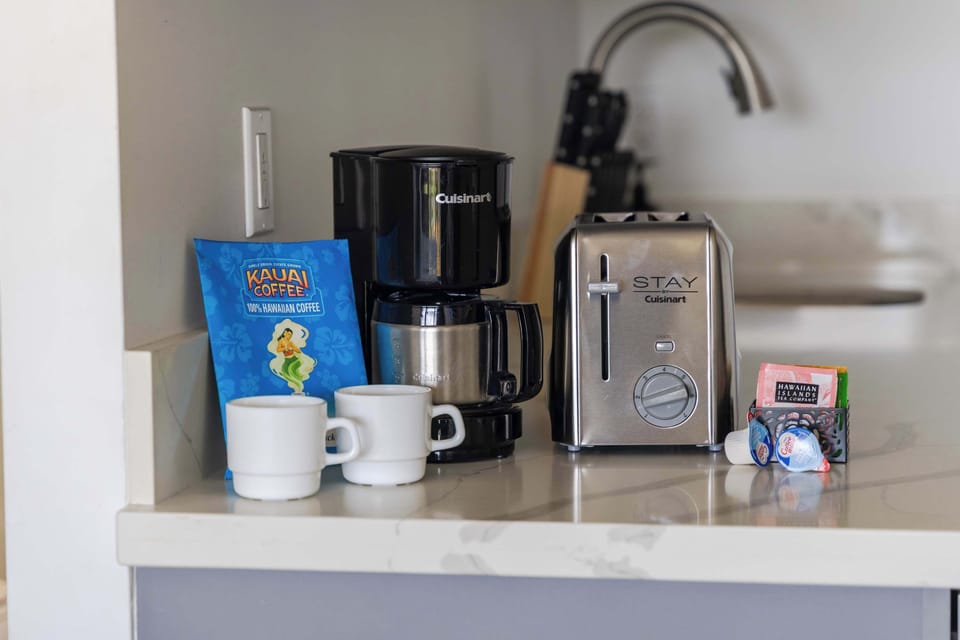 Start your morning right in your coffee station in the kitchenette area, complete with a Cuisinart drip coffee maker, local Kauai Coffee, a stainless steel toaster, and complimentary mugs to fuel your island adventures!