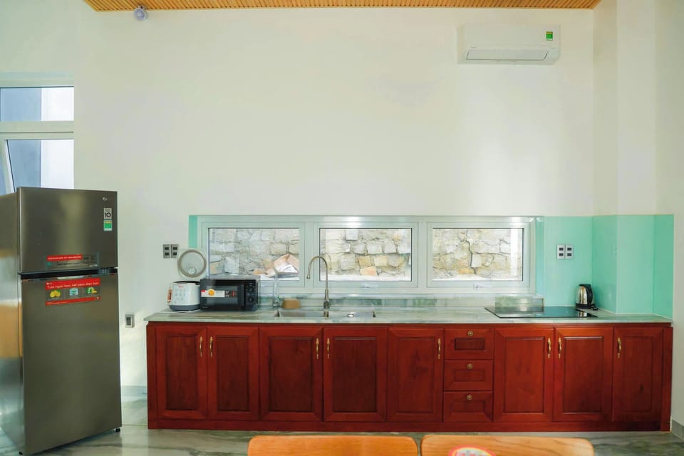 Deluxe Villa, 4 Bedrooms, Balcony, Beachfront | Private kitchen | Electric kettle