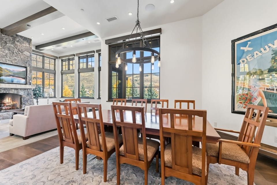 Dining area: Main floor, table seating for 10, barstools for 3, balcony access