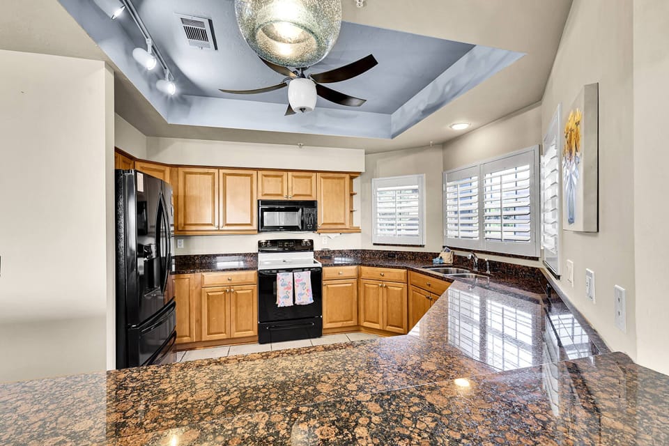 The spacious kitchen has full size appliances, including french door refrigerator/freezer, oven, microwave and dishwasher.