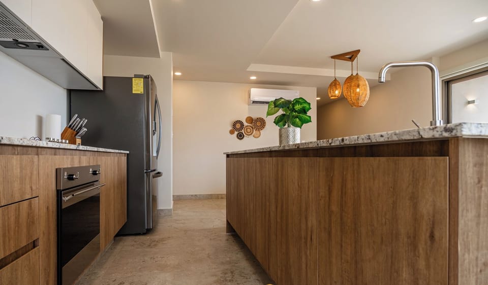 Deluxe Apartment, 2 Bedrooms, Partial Ocean View | Private kitchen | Coffee/tea maker, oven, dishwasher, blender