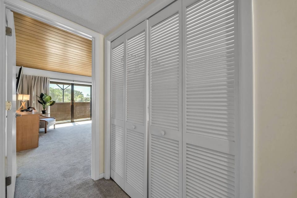 Convenient laundry unit just steps from the primary bedroom — making longer stays or family trips effortless.