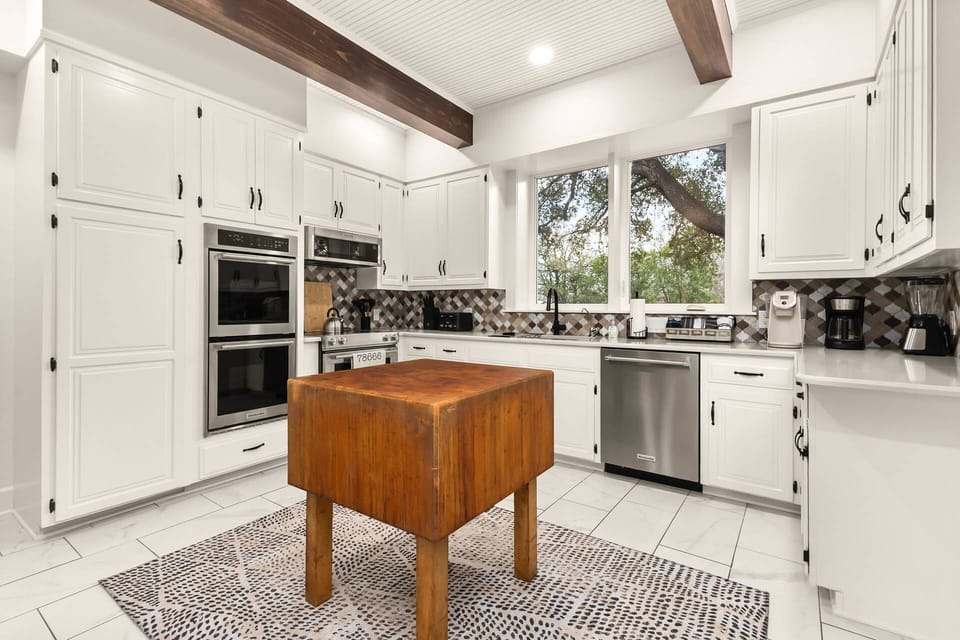 This bright, chef-ready kitchen blends modern appliances with rustic charm and natural light.