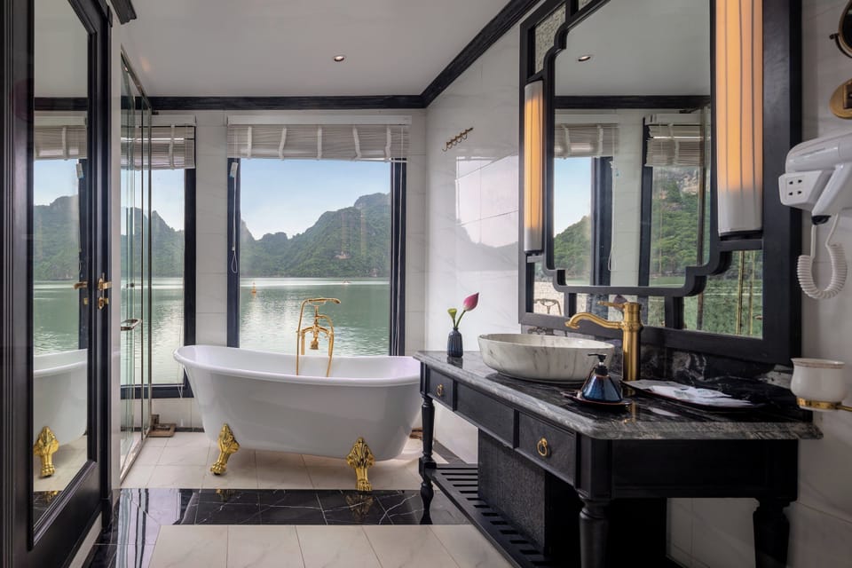 Luxury Suite, Balcony, Ocean View | Bathroom | Shower, hair dryer, slippers, towels