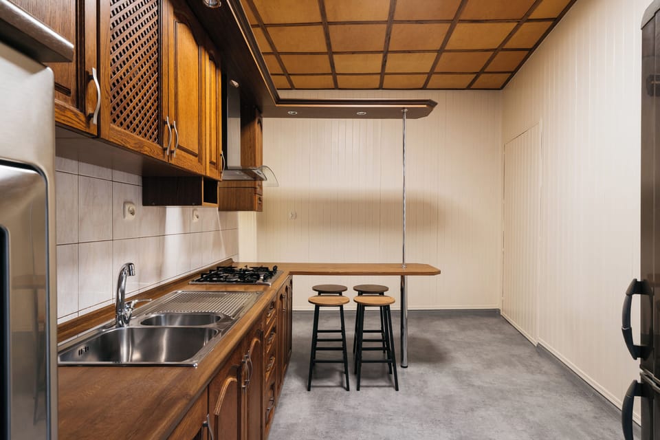 Apartment, Balcony, City View | Private kitchen | Griddle, dining tables