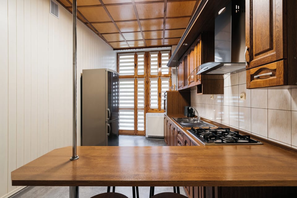 Apartment, Balcony, City View | Private kitchen | Griddle, dining tables