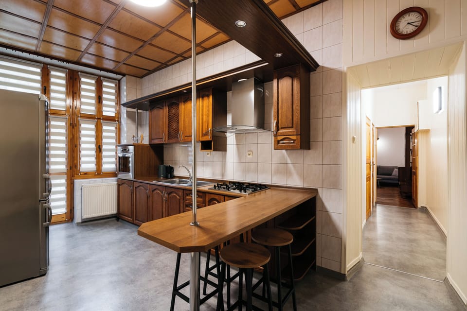 Apartment, Balcony, City View | Private kitchen | Griddle, dining tables