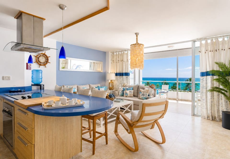 Oceanview living room with A/C, smart TV, and direct access to private balcony.