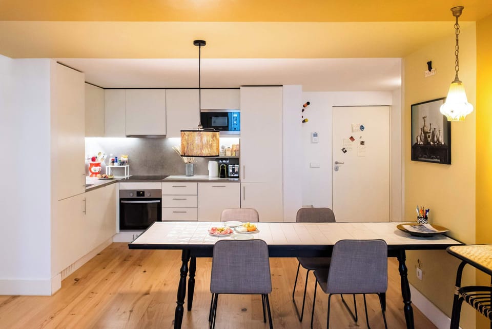 Fully equipped kitchen with oven, hob, microwave, and fridge-freezer