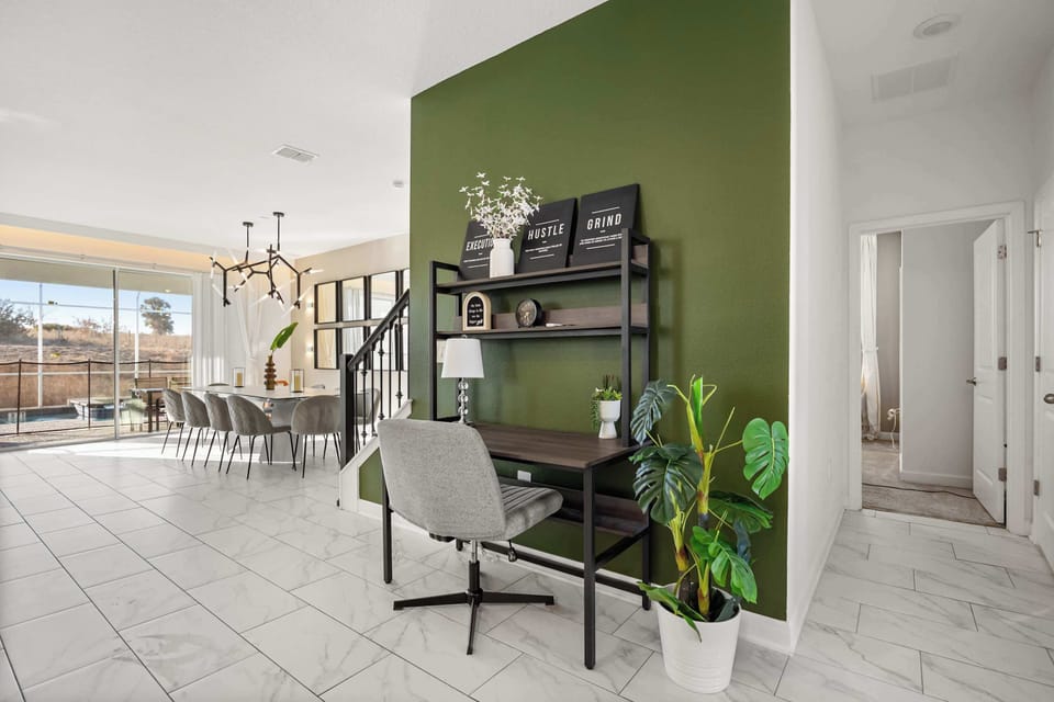 Spacious dining area with pool view, perfect for gatherings and relaxation.