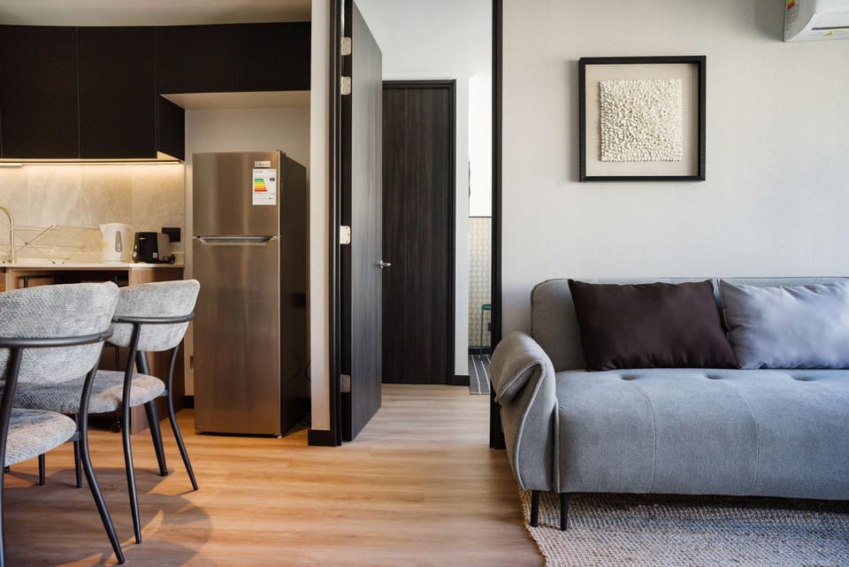 Modern living space with sleek furnishings and cozy seating, perfect for relaxation.