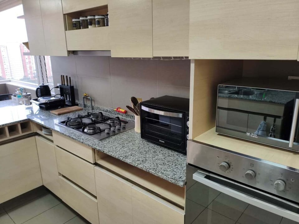 Cook up a storm in this modern kitchen with sleek appliances and ample natural light.