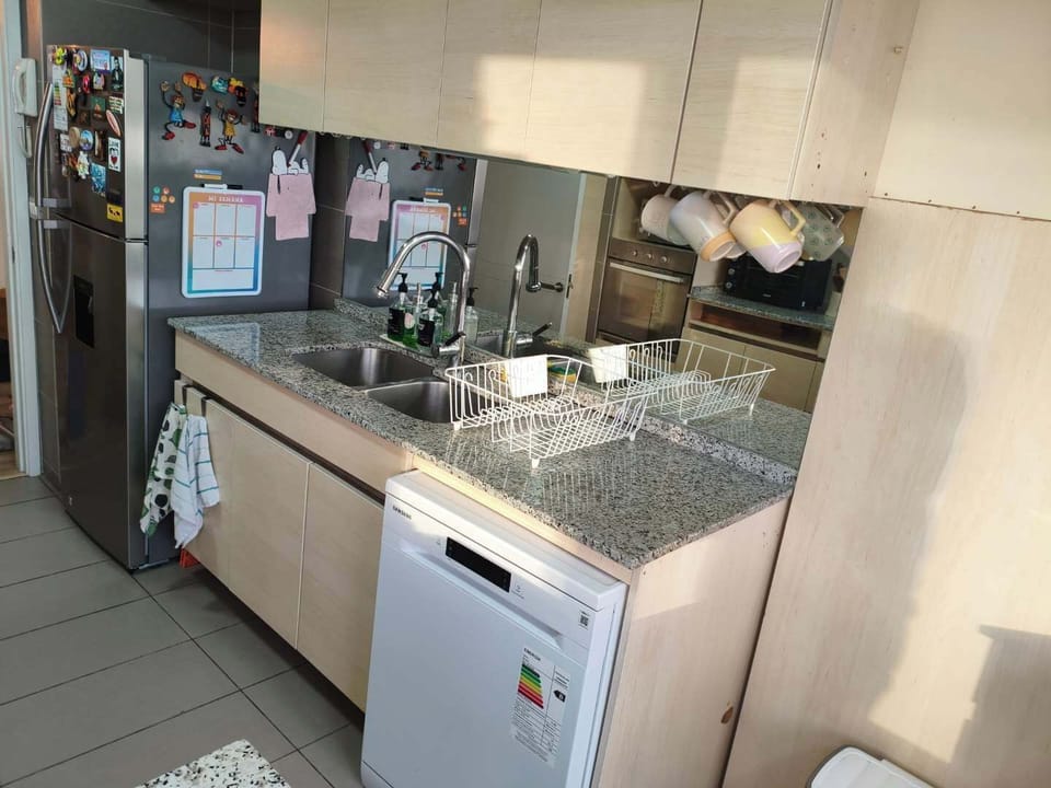 Cozy kitchen with modern appliances and granite countertops, perfect for preparing meals during your stay.