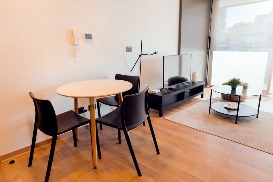 Cozy living space with modern amenities and abundant natural light, perfect for a relaxing stay.