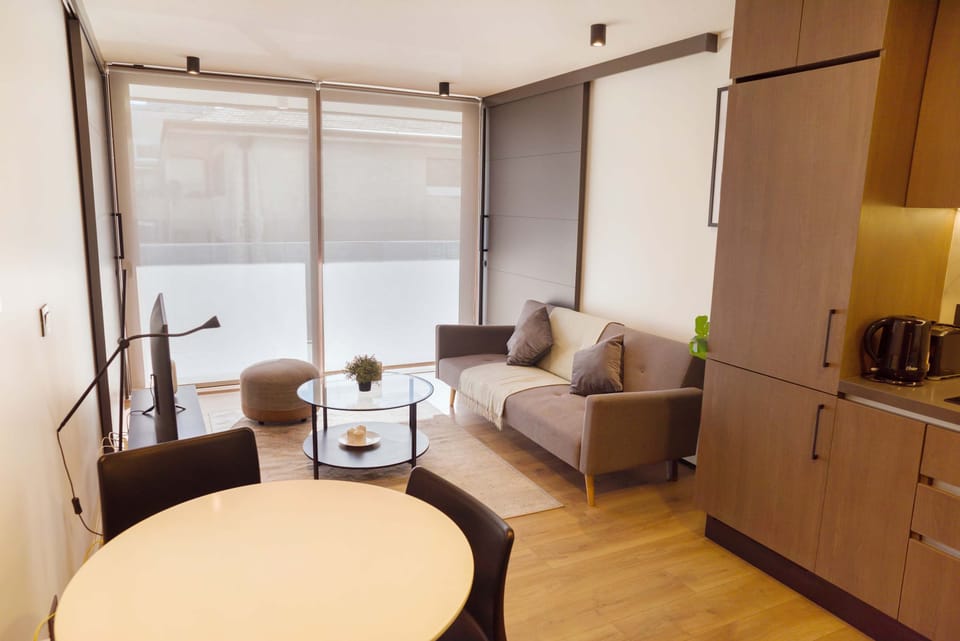 Cozy living space with modern amenities and natural light, perfect for relaxation and entertainment.