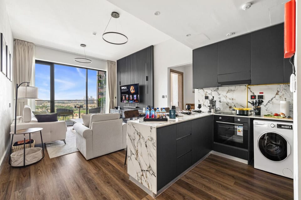 Dining area with open living space and balcony access.