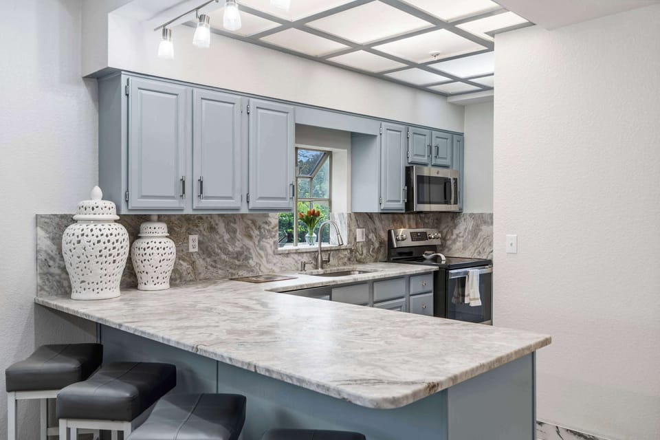 The open kitchen offers ample space & all the comforts of home​
