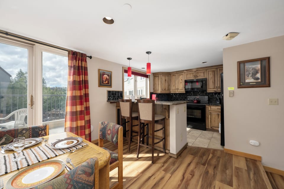 Your open-concept space blends kitchen and living areas, perfect for gathering while you cook and enjoy mountain views.