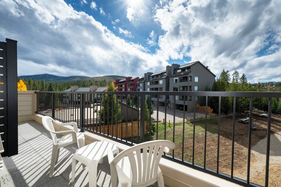 Step onto your private balcony and enjoy mountain views while sipping morning coffee in the peaceful outdoor seating area.