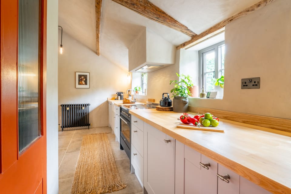 Ground floor: Kitchen and utility with an electric Range cooker and induction hob, fridge/freezer, washing machine and Nespresso coffee machine