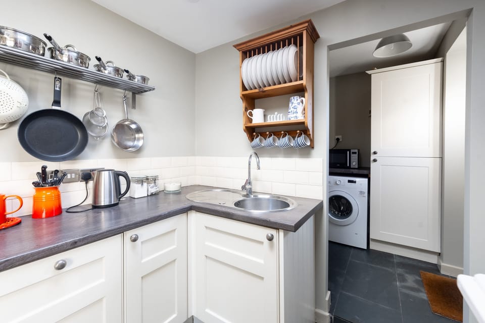 Ground floor: Kitchen and utility area and WC beyond