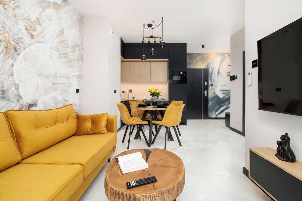The elegant living room featuring a double sofa bed, perfect for relaxing or sleeping.